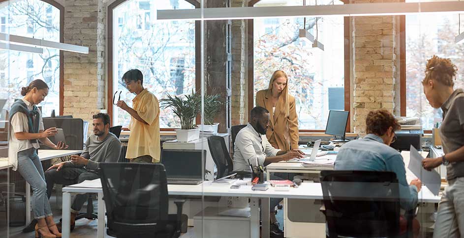 People in an office working close together after installing ActivePure during the COVID crisis.