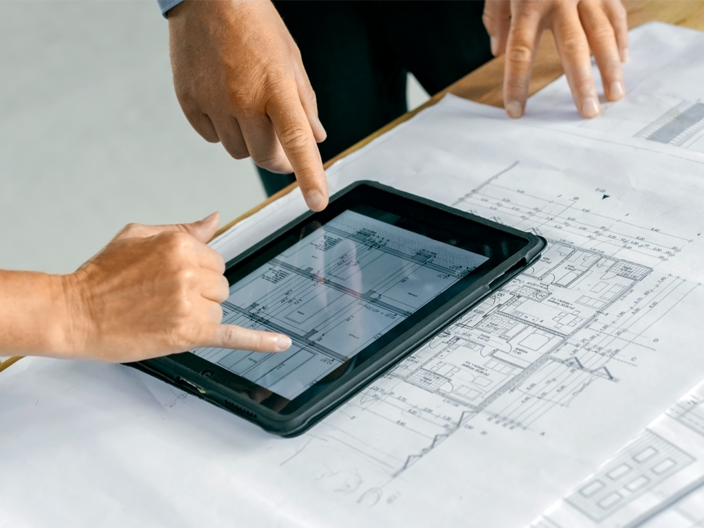 Advanced Air & Surface Purification Technology Blog - ActivePure Technology - Page 15 A person reviewing building plans with an expert. ActivePure will help you to understand how you can comply with the new ASHRAE 241 Indoor Air Quality Standards.