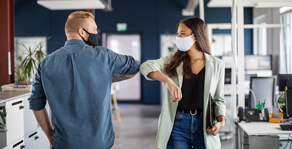 A man and a woman touching elbows in an office instead of shaking hands in an office. Just as it is important not to transfer germs, PM2.5 is just as important to control in office spaces. Ah, the corporate office building! Alas, many of your employees haven’t basked in its fluorescent glory for nearly two years. Soon, however, everyone will happily huddle once more in that near- windowless, monochromatic hive. After all, the air conditioning needs to blow the stagnant, freezing air of a thousand recycled sneezes down the back of somebody’s neck, or what’s an