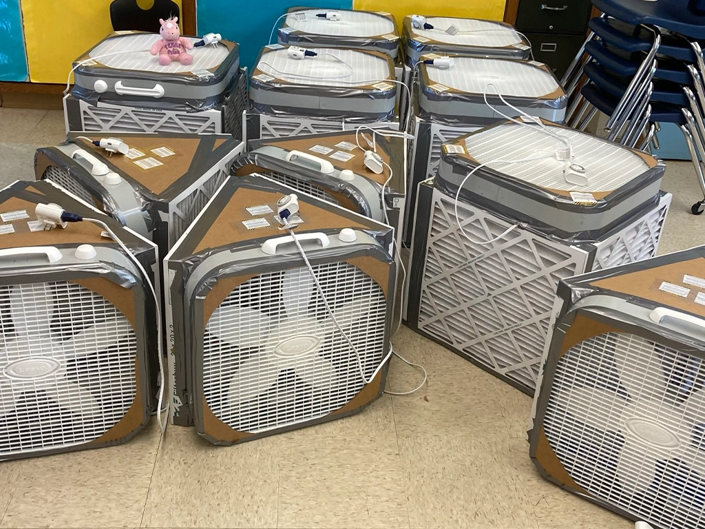 Corsi-Rosenthal boxes lined up; While good as a temporary solution they are not as effective as air purifiers.