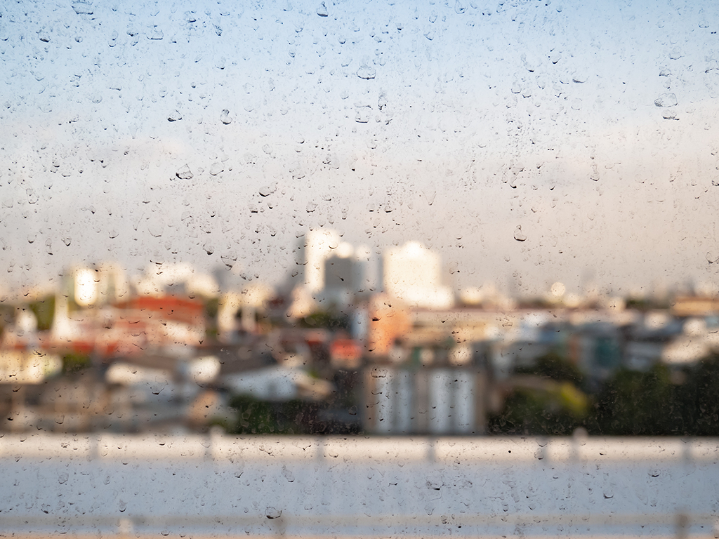 Dried dirt on exterior window due to poor air quality