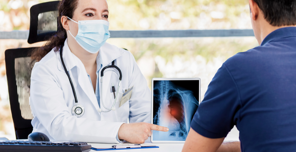 Female doctor reviewing lung scans with a patient after COVID. Long Covid describes the conditions that remain after an infection of COVID.
