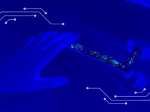 Hand over a door handle, with fingerprints and germs present on the handle; Technologies need to address surface purification as well as air purification to prevent the spread of HAIs.