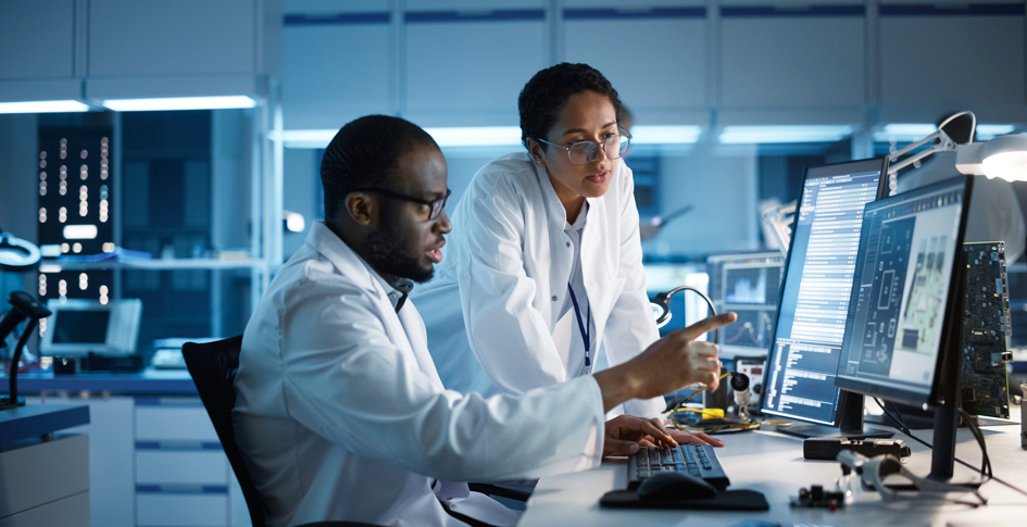 Two scientists analyzing test data, ActivePure discusses data on PECO technology vs. ActivePure Technology.