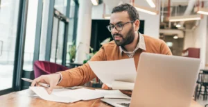 Business owner reviewing business expenses associated with Covid-19