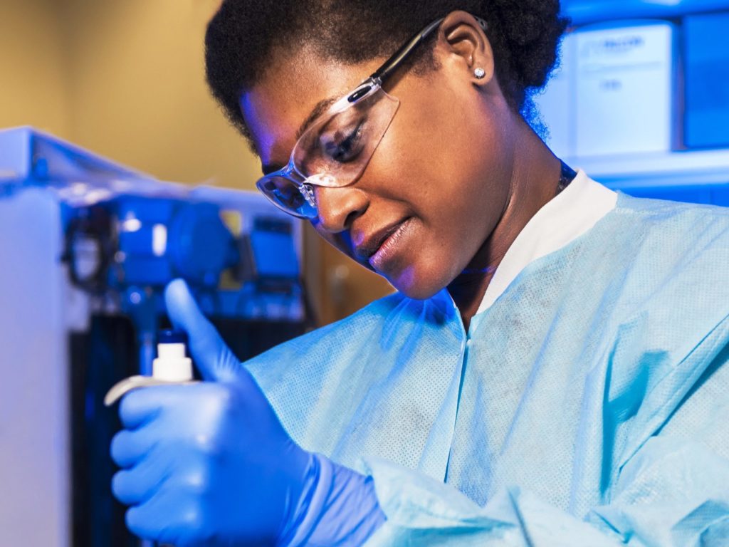 Doctor injecting sample with solution during indoor air quality testing